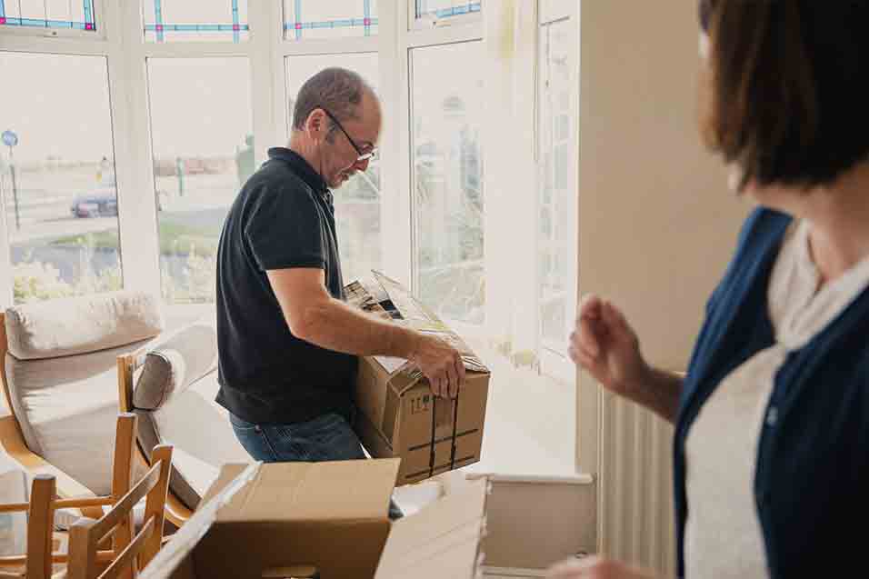 man holding boxes